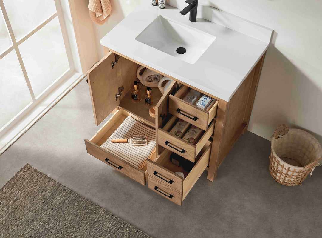 Bathroom vanity with open drawers containing toiletries, next to a window.