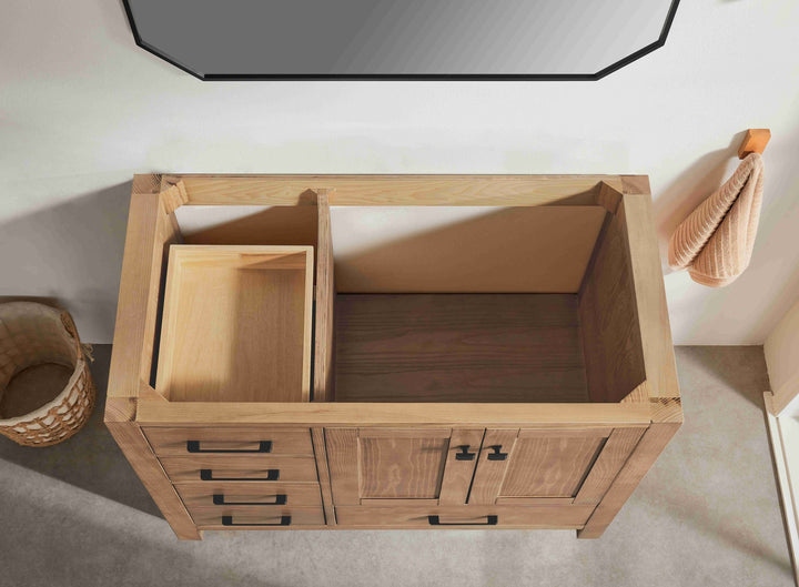 Wooden cabinet with open doors on a light-colored floor.