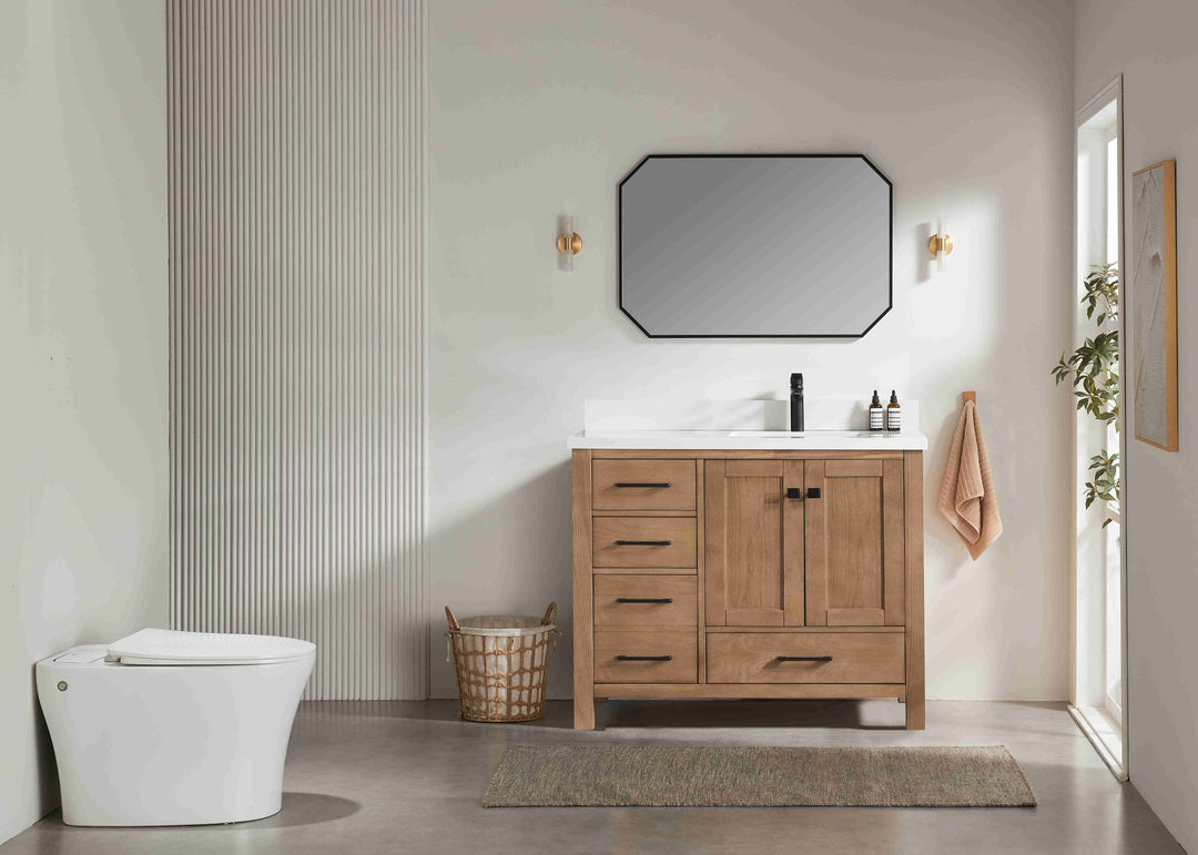 Bathroom with wooden vanity, toilet, and mirror