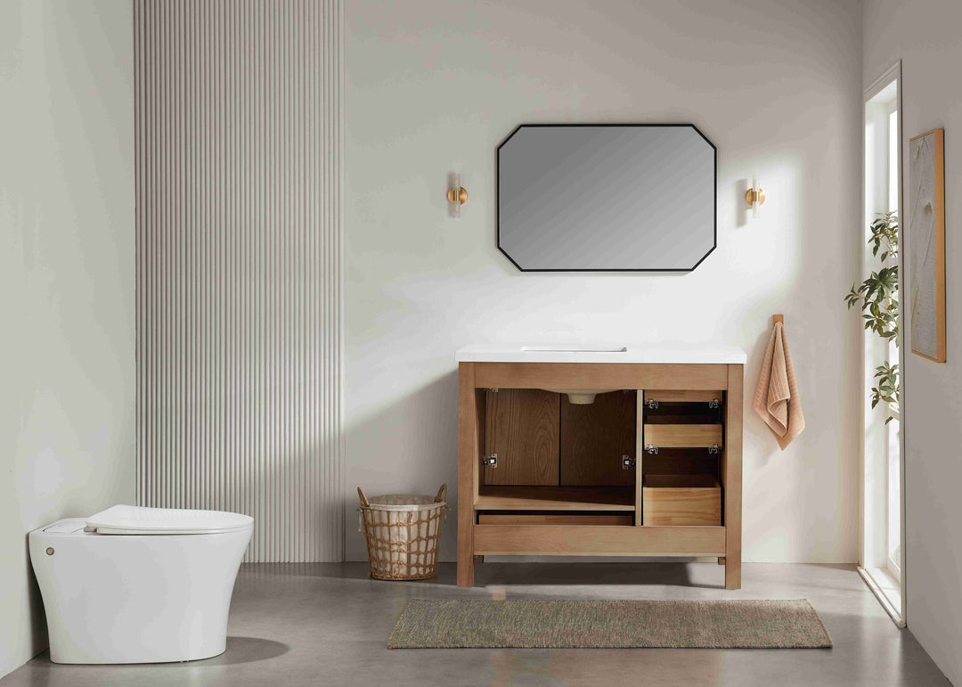Bathroom interior with wooden vanity, toilet, and mirror.