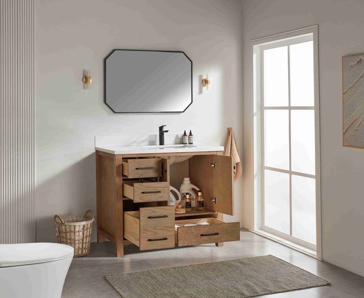 Bathroom with wooden vanity, mirror, and window