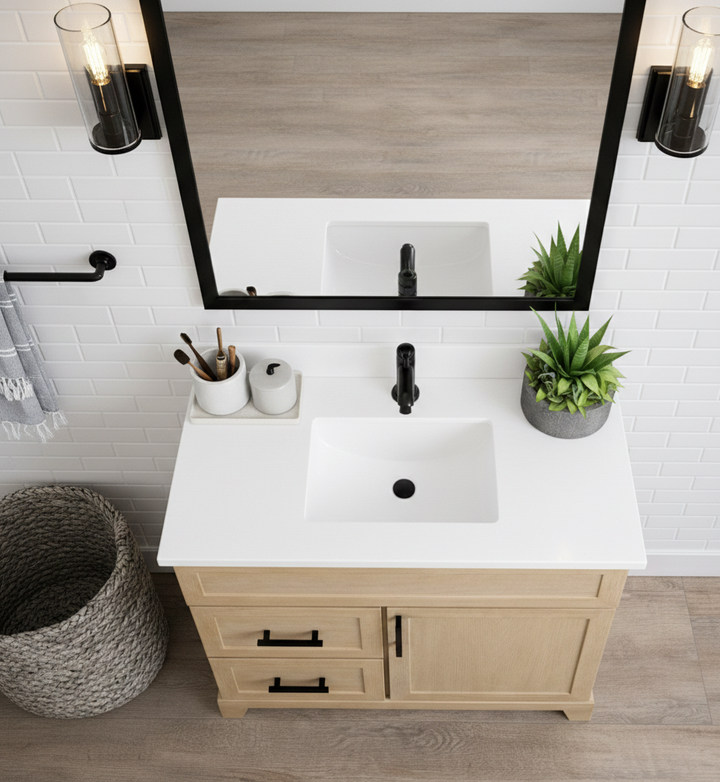Bathroom vanity with white countertop, mirror, and decorative elements.