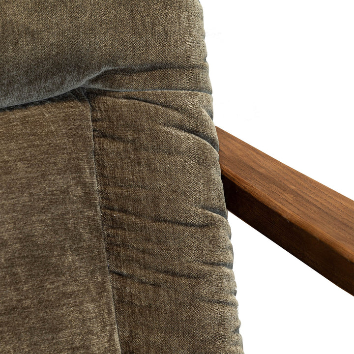 Close-up of a brown textured fabric with a wooden surface in the background