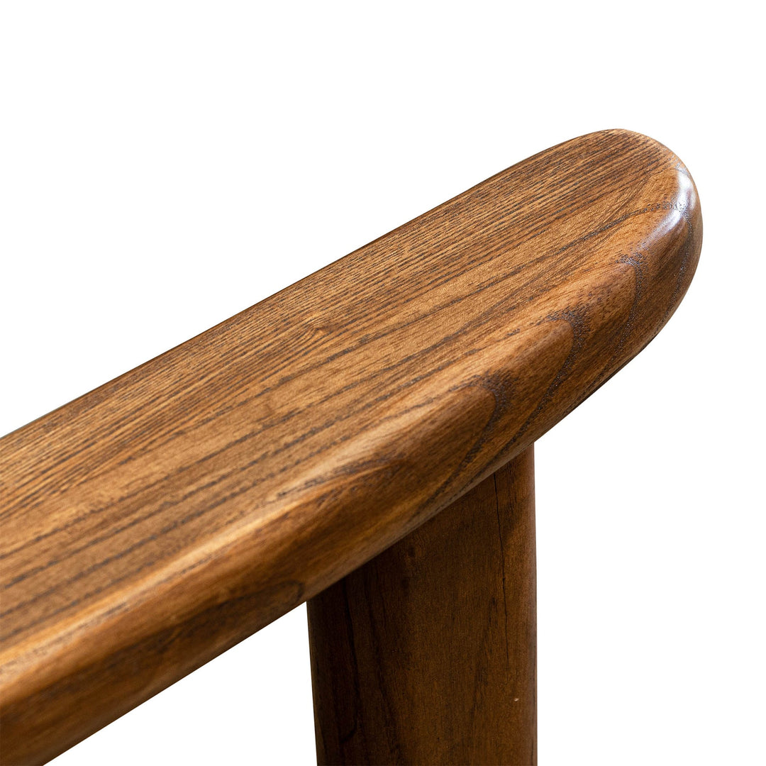 Close-up of a wooden chair seat on a white background